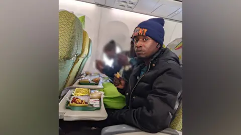 Joshua Mollel Joshua Mollel on the plane to Israel.