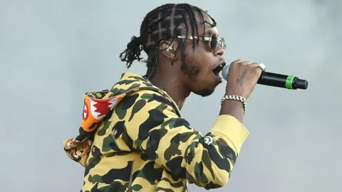 Getty Images Krept performing on stage