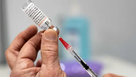 European Pressphoto Agency A vial of Novavax"s COVID-19 vaccine