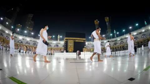 Reuters Muslims keep a safe social distance while performing Umrah at the Grand Mosque on 3 October 2020