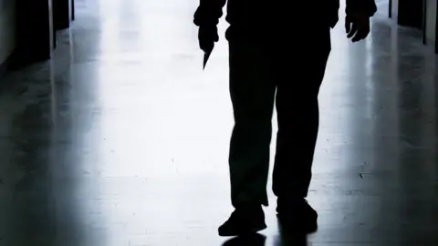 Getty Images Stock image of a person with a knife