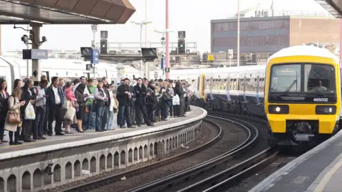 Getty Images train pulling into crowded station