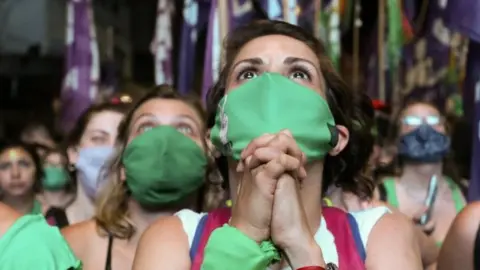 Reuters A demonstrator in favour of legalizing abortion reacts as the senate debates an abortion bill, in Buenos Aires, Argentina, December 30, 2020.