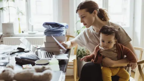 Getty Images Woman looking a energy bill