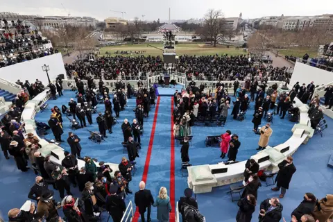 Reuters President-elect Joe Biden and his wife Jill Biden arrive for his inauguration as the 46th President of the United States on the West Front of the U.S. Capitol in Washington, U.S., January 20, 2021.