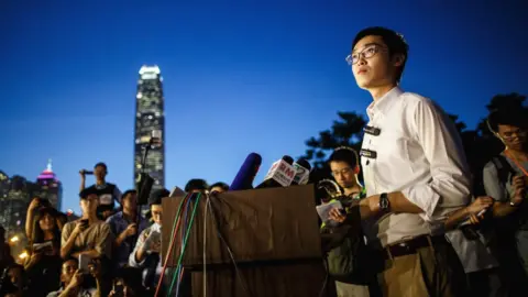 Getty Images Andy Chan, leader of the pro-independence Hong Kong National Party, addresses supporters in Hong Kong, 5 August 2016