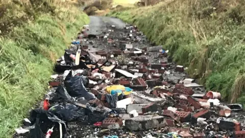 Marita Head Flytipped rubbish on road