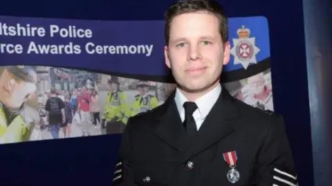 AFP Detective Sergeant Nick Bailey pictured at a police awards ceremony