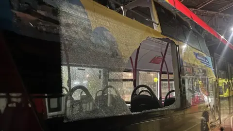 First Bus Service 111 bus in Wales with a shattered window
