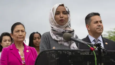 Getty Images US Democratic congresswoman Ilhan Omar announcing a new bill to end lunch debt "shaming"