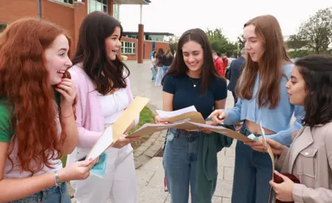 PA Media Girls at Regent House School in Newtownards discuss their A-level results