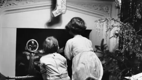 Getty Images Children waiting for Santa in the 1950s