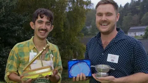 Adam Kiani Adam Kiani holding his golden spurtle award and specialty winner, Bobby Fisher