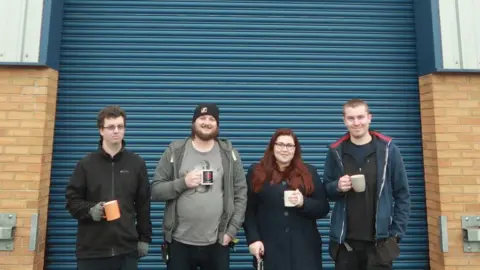 Mohit Basudev Tom Feierabend, second from left, is one of an army of entertainment pros helping build the Dragon's Heart hospital