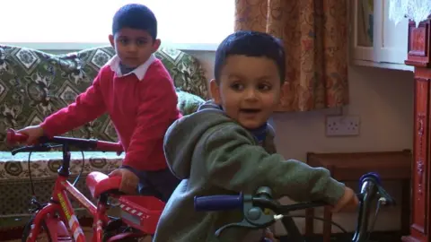 Umair and his cousin playing at home