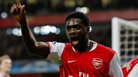 Kolo Toure celebrates scoring a goal for Arsenal