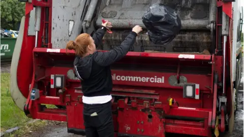 BBC woman dealing with her own rubbish