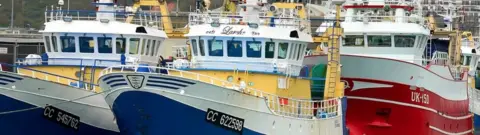 PA Media Fishing boats moored in the port of Boulogne-sur-Mer