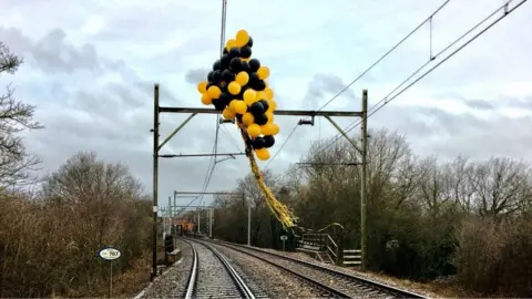 Network Rail Balloons wrapped around overhead electric lines