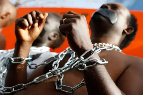 AFP African migrants demonstrate against the Israeli government's policy to forcibly deport African refugees and asylum seekers from Israel to Uganda and Rwanda, outside the Rwanda embassy on January 22, 2018 in the Israeli city of Herzliya.
