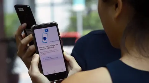 AFP Singapore uses a strict contact tracing programme to try to control the spread of coronavirus