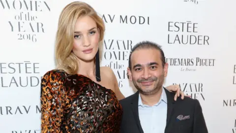 Getty Images Rosie Huntington-Whiteley and Nirav Modi pictured together in 2016