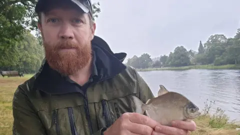 Ness Fishery Board Chris Conroy with the fish