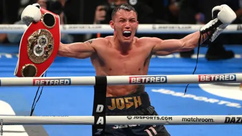 Josh Warrington celebrates his win over Kiko Martinez