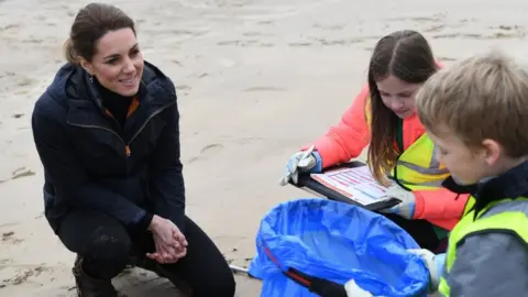 Getty Images Catherine, Duchess of Cambridge joins primary school pupils in a beach clean-up on Newborough Beach