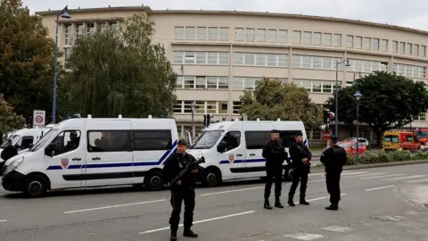 Reuters Police guarding the school in Arras after Friday's attack