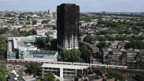 Getty Images Grenfell Tower with a Tube train passing nearby
