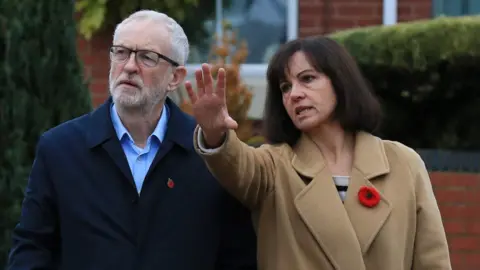 AFP/Getty Images Jeremy Corbyn and Caroline Flint