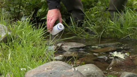 BBC Taking a water sample