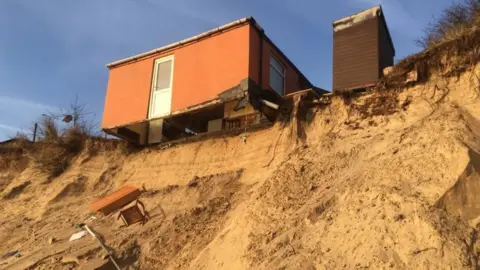 Hemsby house teetering over the sand dune