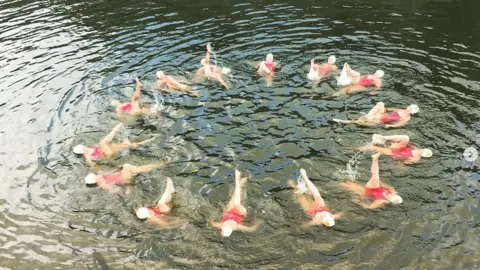 Richard Maxwell Synchronised swimmers performing in open water