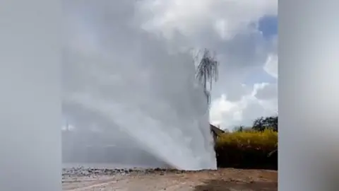 A still from the TikTok video which shows water shooting into the air