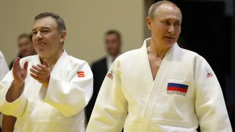 Getty Images Arkady Rotenberg and Vladimir Putin wearing judo kit in Sochi in February 2019
