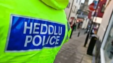 North Wales Police vest on street