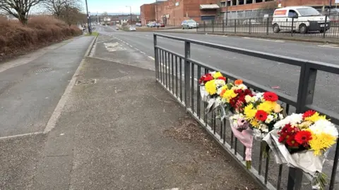 Hayley Grice/BBC Floral tributes at Greens Way, Mexborough