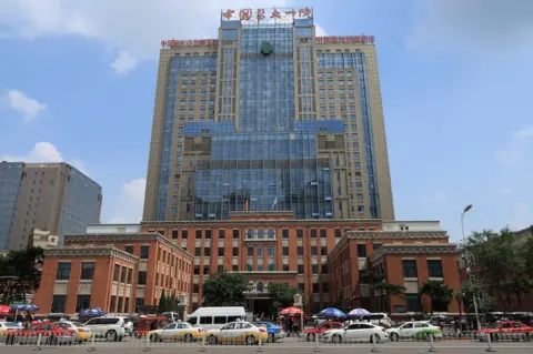 Reuters Vehicles pass in front of building number 1 of the First Hospital of China Medical University in Shenyang where friends of sick dissident Liu Xiaobo say he is being treated, in Shenyang, China 10 July 2017.