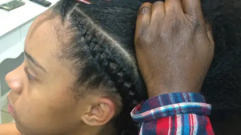 Kate Williams Ruby getting her hair braided