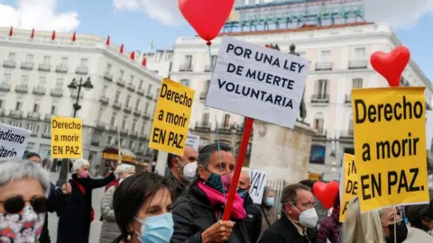 Reuters Supporters of a law to legalise euthanasia gather as the Spanish Parliament votes to approve it in Madrid, Spain