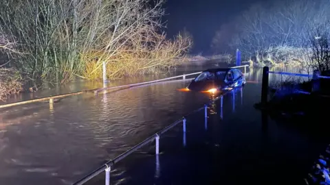 Essex Fire and Rescue Car in floodwater