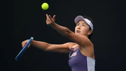 Getty Images Peng Shuai of China in action during her Women's Singles first round match against Nao Hibino of Japan on day two of the 2020 Australian Open at Melbourne Park on January 21, 2020 in Melbourne, Australia.