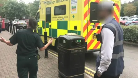SWNS Parking attendant and paramedic arguing