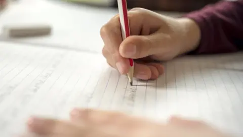 Getty Images Person writing