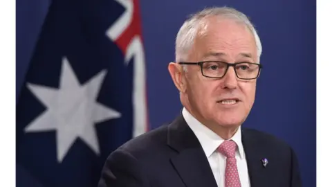 EPA Malcolm Turnbull in front of an Australian flag