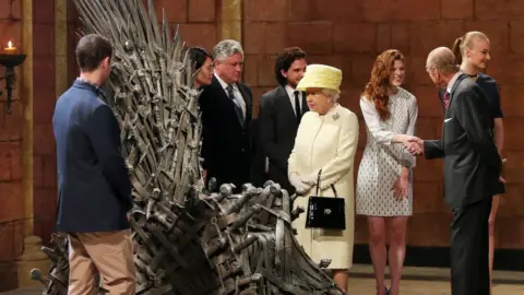 Getty Images The Queen and Duke of Edinburgh visiting the set of Game of Thrones in Belast in 2014