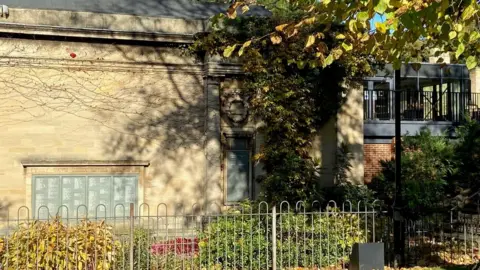 Maura Bright  The Alfred East Gallery, built in 1903, showing the new building at the back