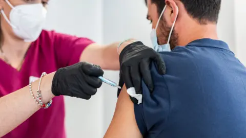 Getty Images A person receives the Moderna vaccine against Covid-19 in the device launched by Acciona in Madrid, on July 5, 2021